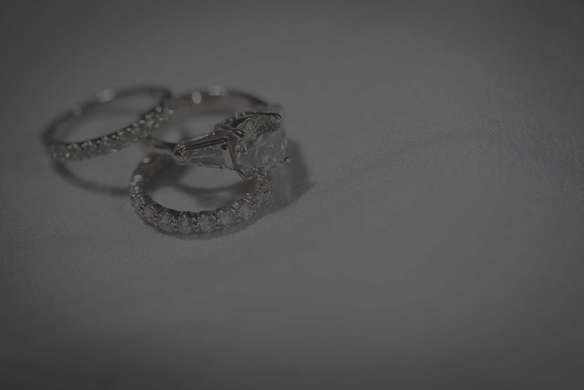 Certified diamond rings inspected at Conrad Jewelry