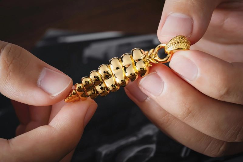A jeweler restoring a piece of fine jewelry at the bench